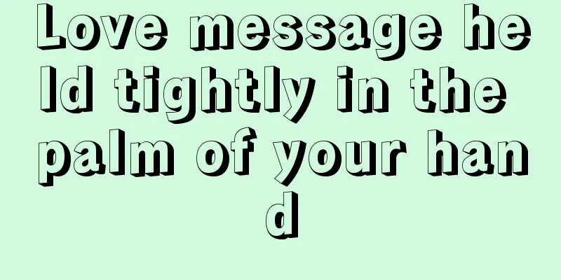Love message held tightly in the palm of your hand