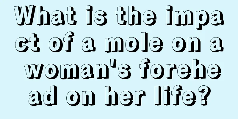 What is the impact of a mole on a woman's forehead on her life?