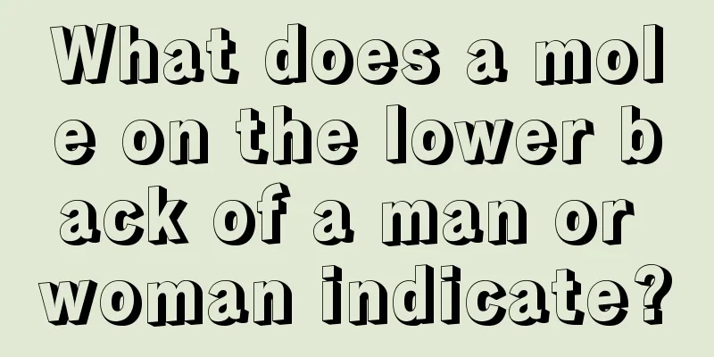 What does a mole on the lower back of a man or woman indicate?