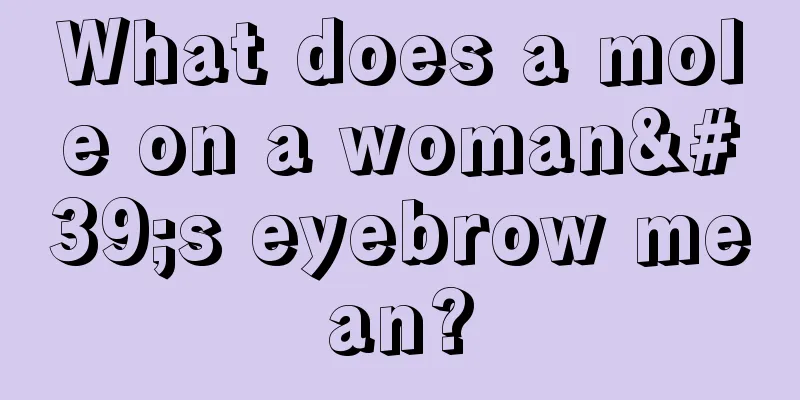 What does a mole on a woman's eyebrow mean?