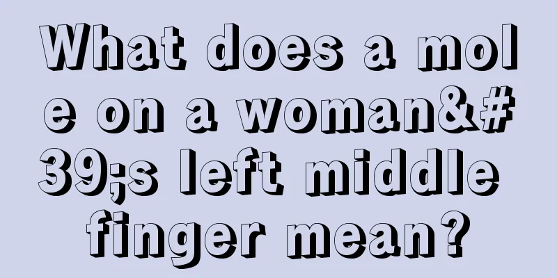 What does a mole on a woman's left middle finger mean?