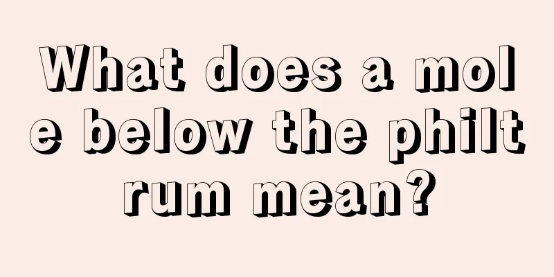 What does a mole below the philtrum mean?