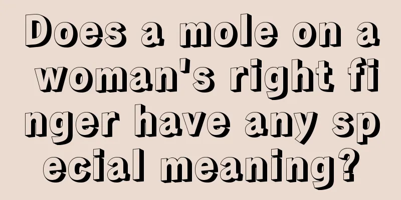 Does a mole on a woman's right finger have any special meaning?