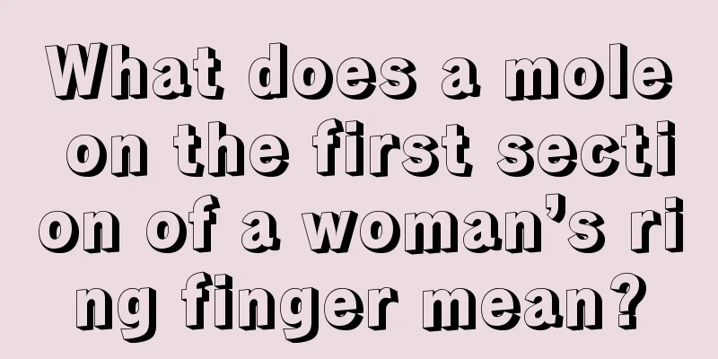 What does a mole on the first section of a woman’s ring finger mean?