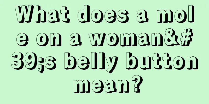 What does a mole on a woman's belly button mean?