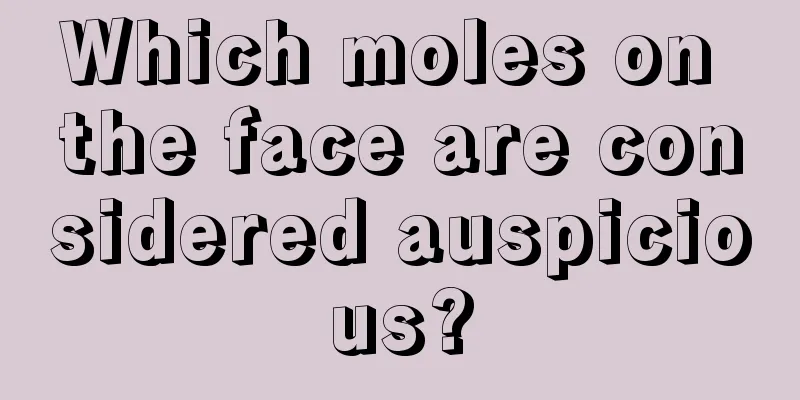Which moles on the face are considered auspicious?