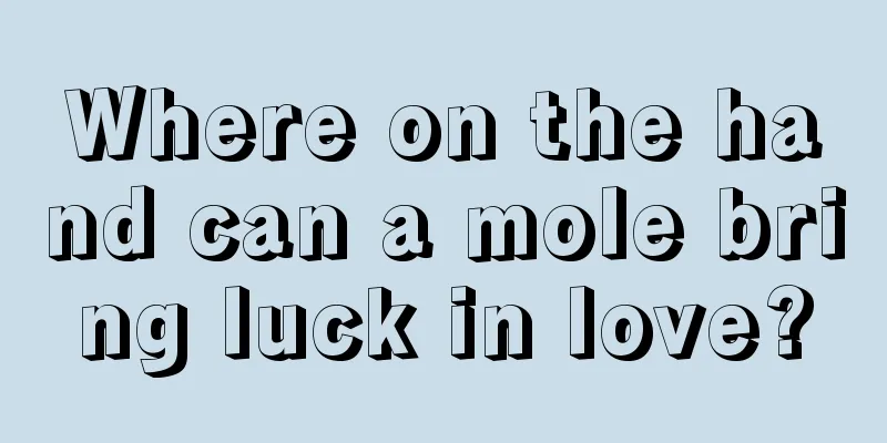 Where on the hand can a mole bring luck in love?