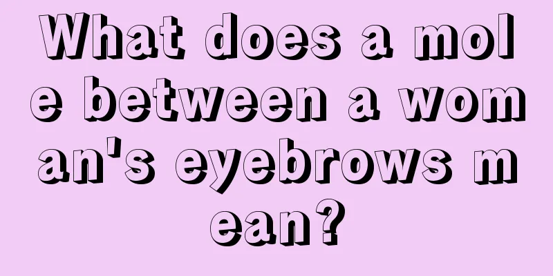 What does a mole between a woman's eyebrows mean?