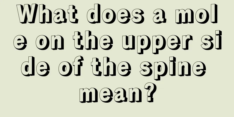 What does a mole on the upper side of the spine mean?