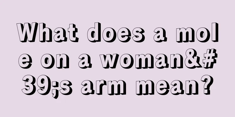 What does a mole on a woman's arm mean?