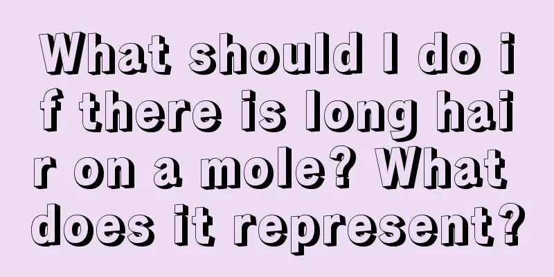 What should I do if there is long hair on a mole? What does it represent?