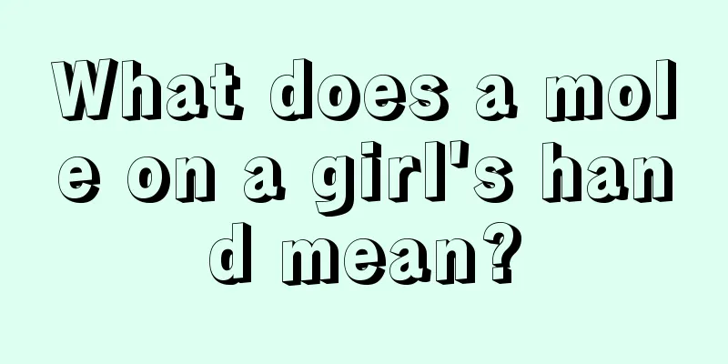 What does a mole on a girl's hand mean?