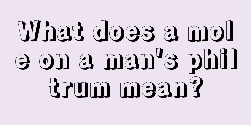 What does a mole on a man's philtrum mean?
