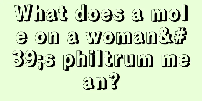 What does a mole on a woman's philtrum mean?