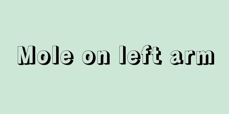 Mole on left arm