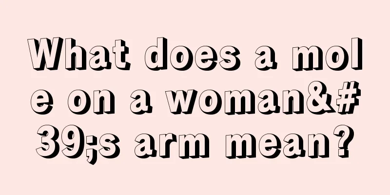 What does a mole on a woman's arm mean?