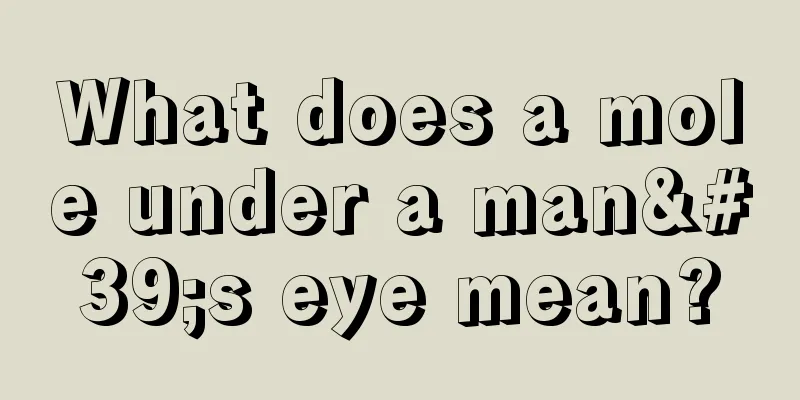 What does a mole under a man's eye mean?