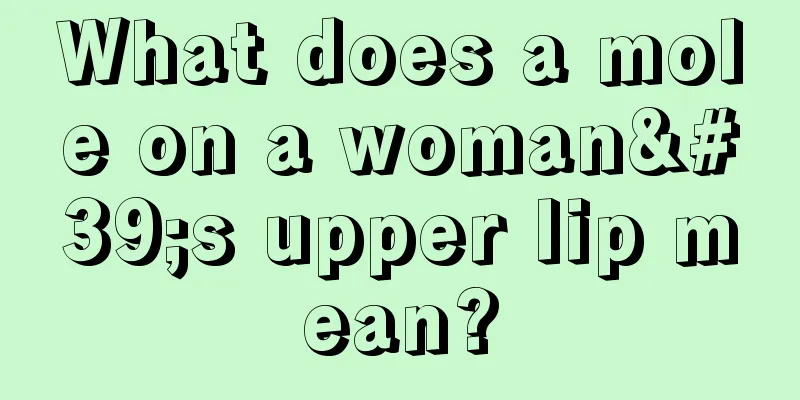 What does a mole on a woman's upper lip mean?