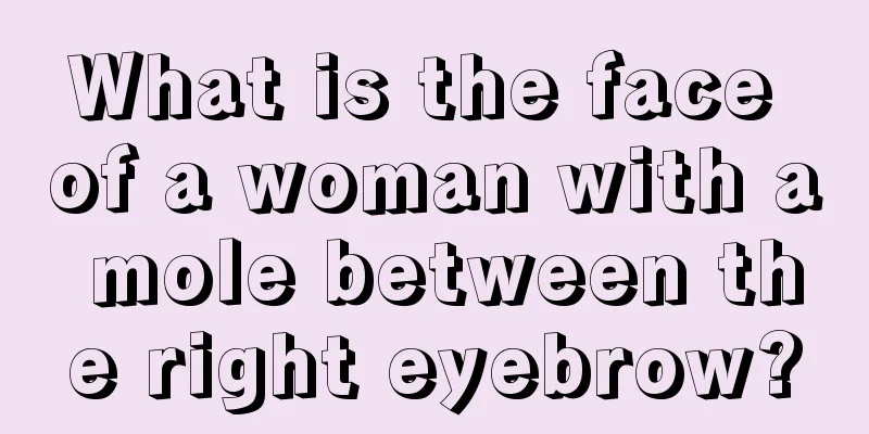 What is the face of a woman with a mole between the right eyebrow?