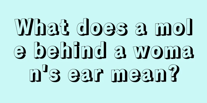 What does a mole behind a woman's ear mean?