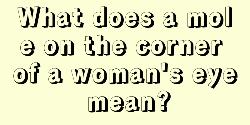 What does a mole on the corner of a woman's eye mean?