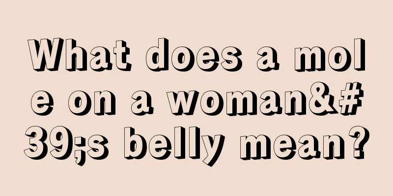 What does a mole on a woman's belly mean?