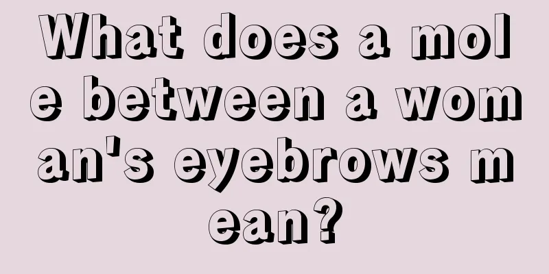 What does a mole between a woman's eyebrows mean?