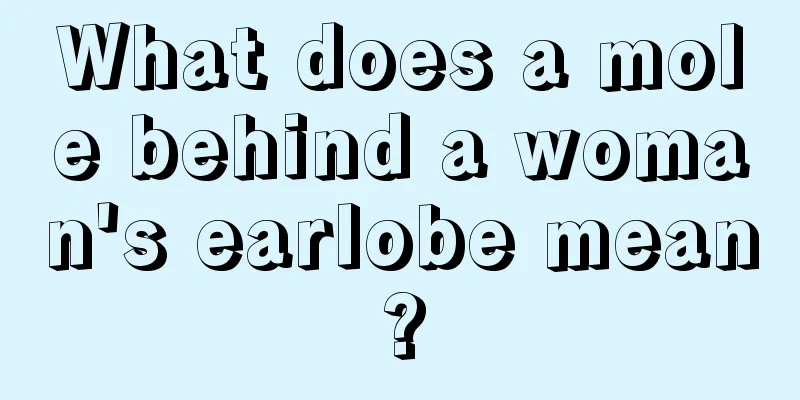 What does a mole behind a woman's earlobe mean?