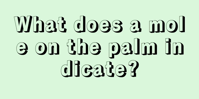 What does a mole on the palm indicate?