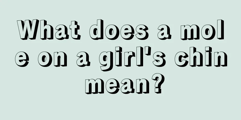 What does a mole on a girl's chin mean?
