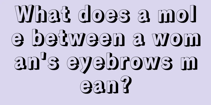 What does a mole between a woman's eyebrows mean?