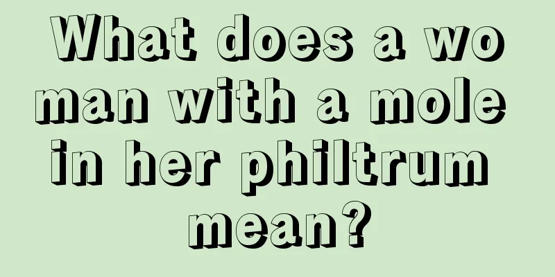 What does a woman with a mole in her philtrum mean?