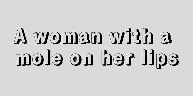 A woman with a mole on her lips