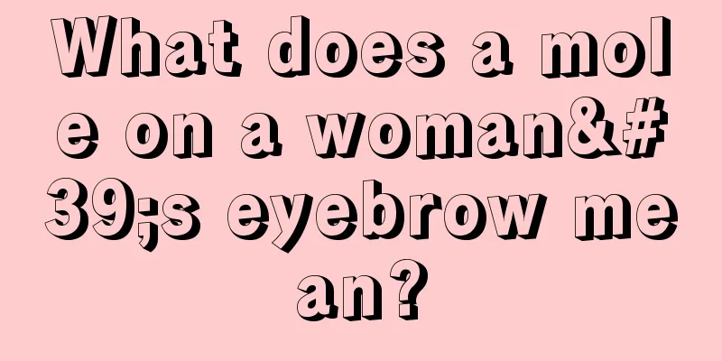 What does a mole on a woman's eyebrow mean?