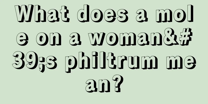 What does a mole on a woman's philtrum mean?