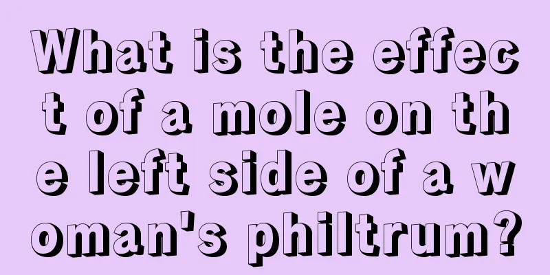 What is the effect of a mole on the left side of a woman's philtrum?