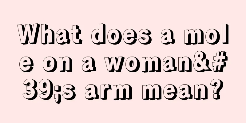 What does a mole on a woman's arm mean?