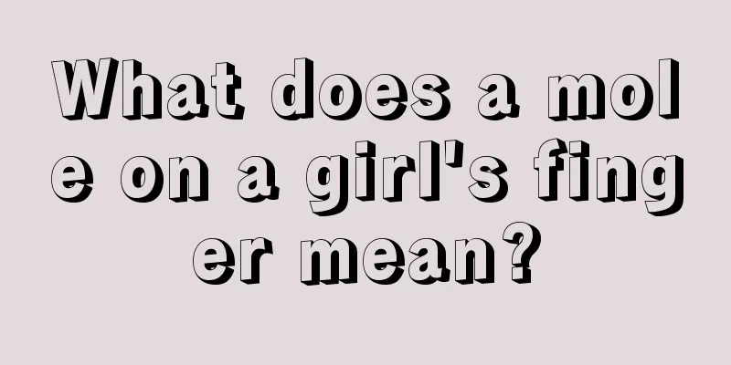 What does a mole on a girl's finger mean?