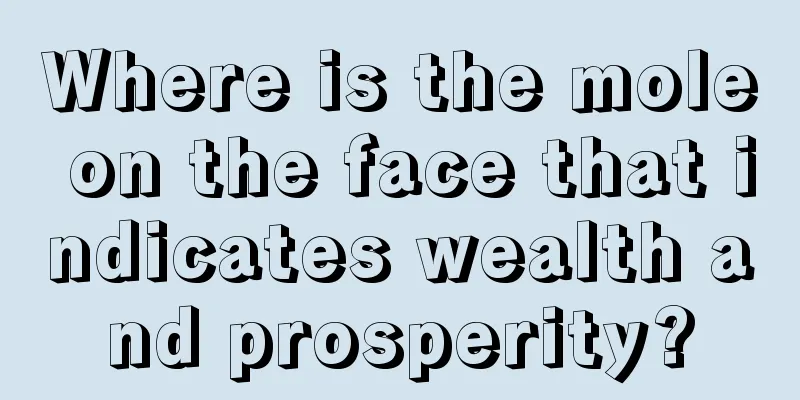Where is the mole on the face that indicates wealth and prosperity?