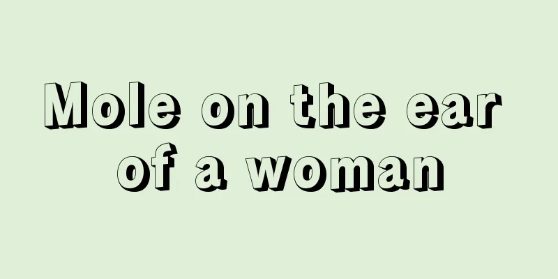 Mole on the ear of a woman