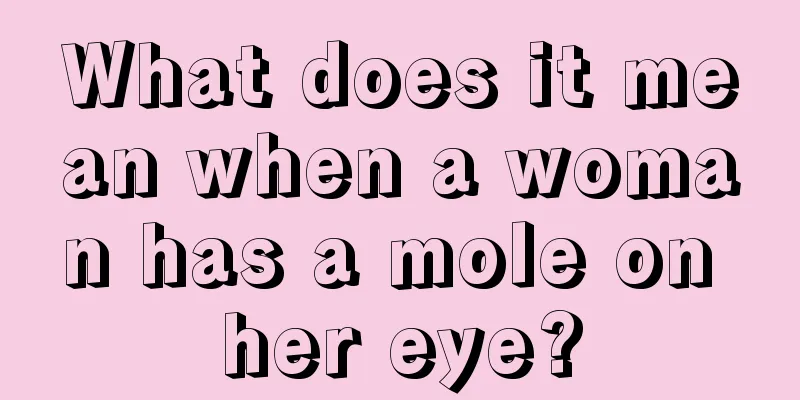 What does it mean when a woman has a mole on her eye?
