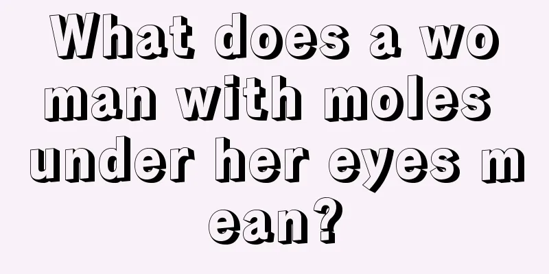 What does a woman with moles under her eyes mean?