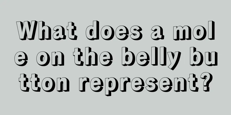 What does a mole on the belly button represent?