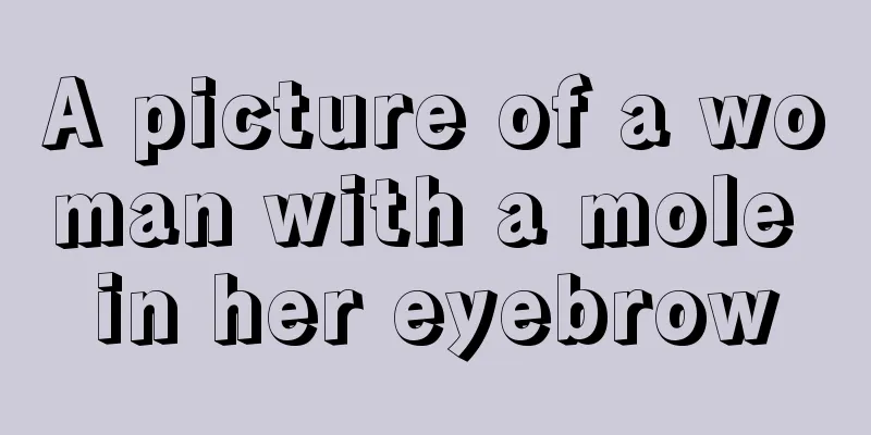 A picture of a woman with a mole in her eyebrow