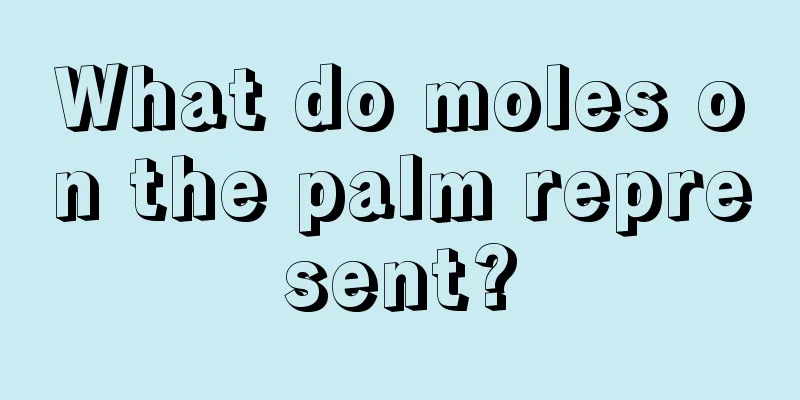 What do moles on the palm represent?