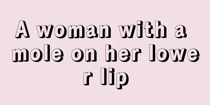 A woman with a mole on her lower lip