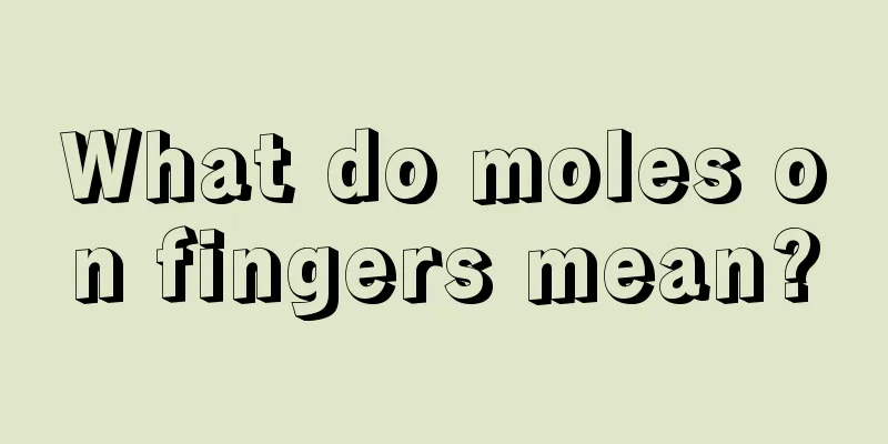 What do moles on fingers mean?