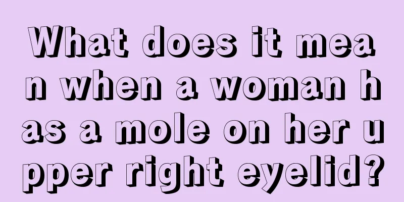 What does it mean when a woman has a mole on her upper right eyelid?