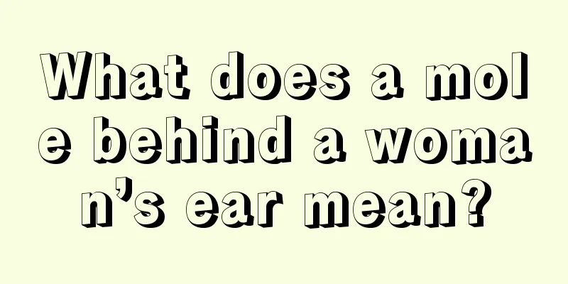 What does a mole behind a woman’s ear mean?