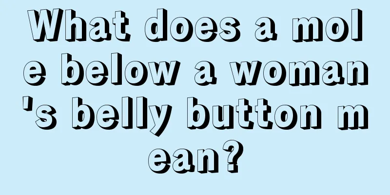 What does a mole below a woman's belly button mean?